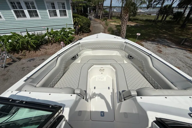 Slide: The Image of 2024 Pursuit DC 306 Dual Console boat with spacious seating and elegant design. - 34