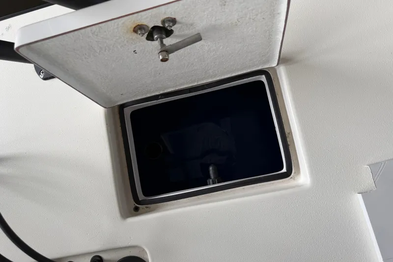 Slide: The Image of Open storage compartment on a 2020 Skimmer Skiff 14 boat. - 14