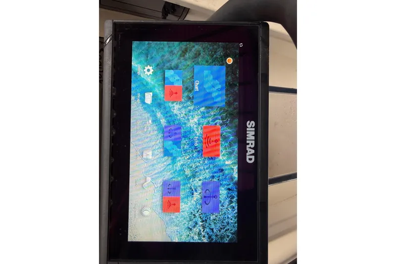 Slide: The Image of Simrad marine display on a 2020 Skimmer Skiff 14, showing navigation and sonar options. - 15