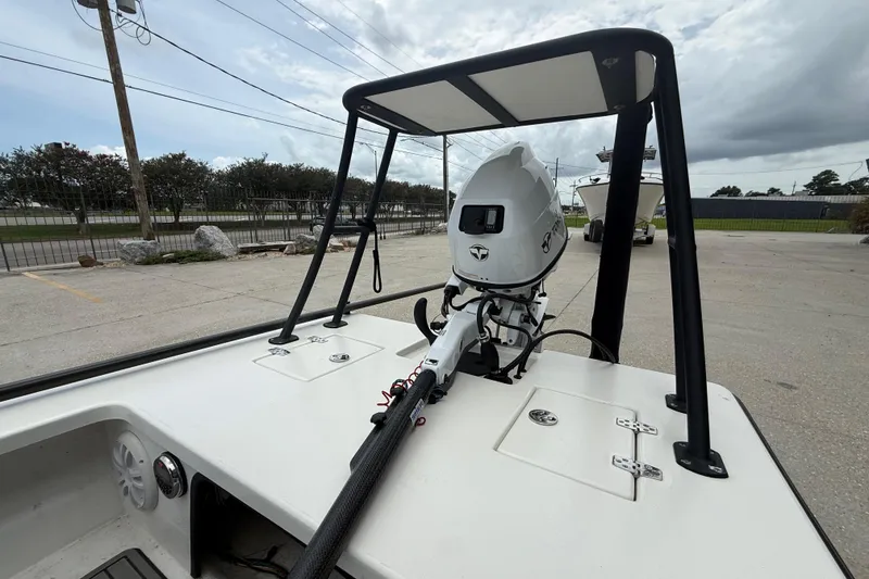 Slide: The Image of 2020 Skimmer Skiff 14 boat with motor, parked outdoors on a cloudy day. - 8