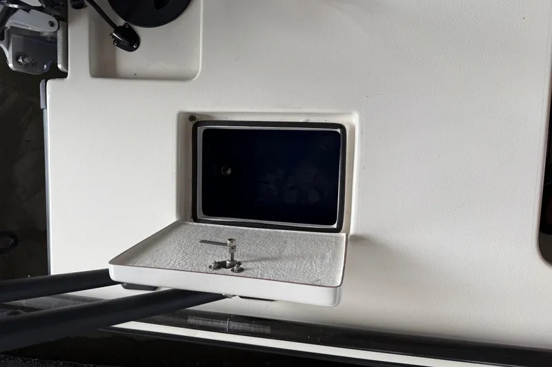 Slide: The Image of Open storage compartment on a 2020 Skimmer Skiff 14 boat deck. - 13