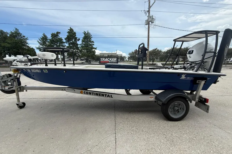 Slide: The Image of 2020 Skimmer Skiff 14 boat on Continental trailer, parked outdoors. - 5