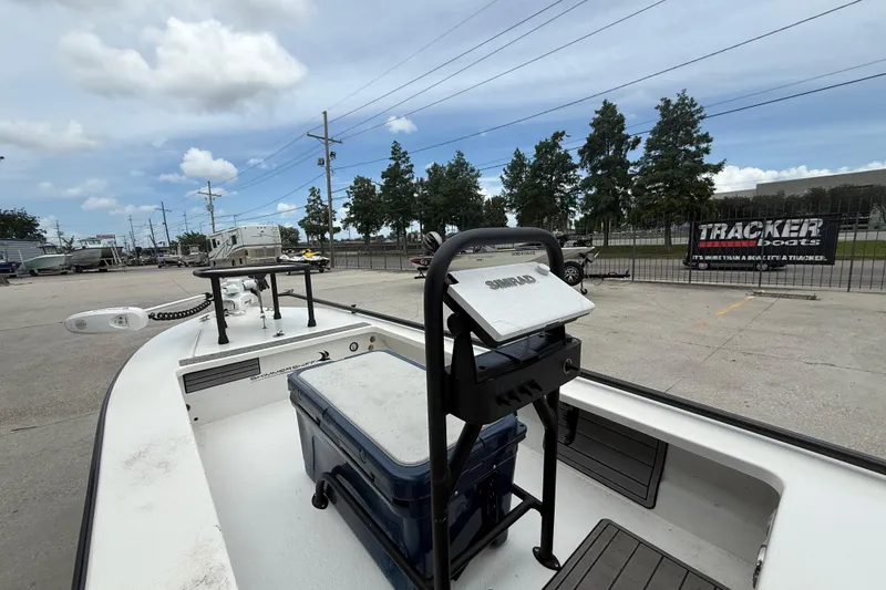 Slide: The Image of 2020 Skimmer Skiff 14 boat with equipment, parked outdoors under a cloudy sky. - 7
