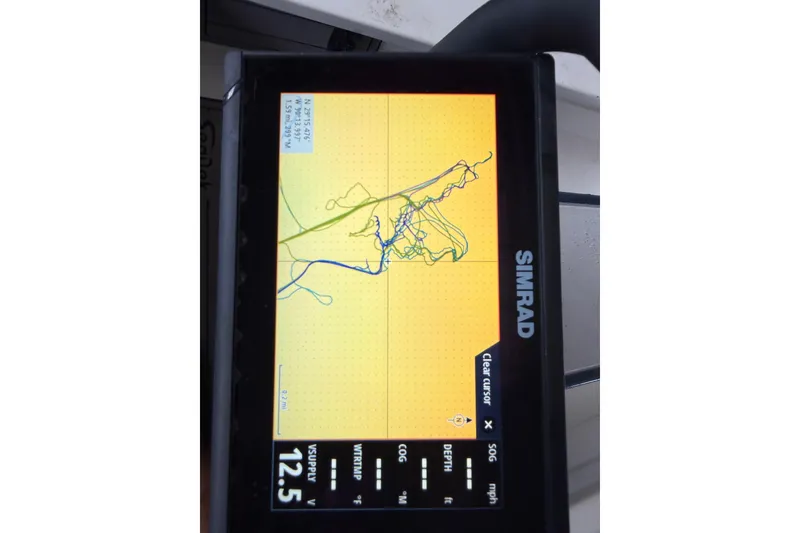 Slide: The Image of Simrad GPS display showing navigation route on Skimmer Skiff 14, 2020 model. - 16