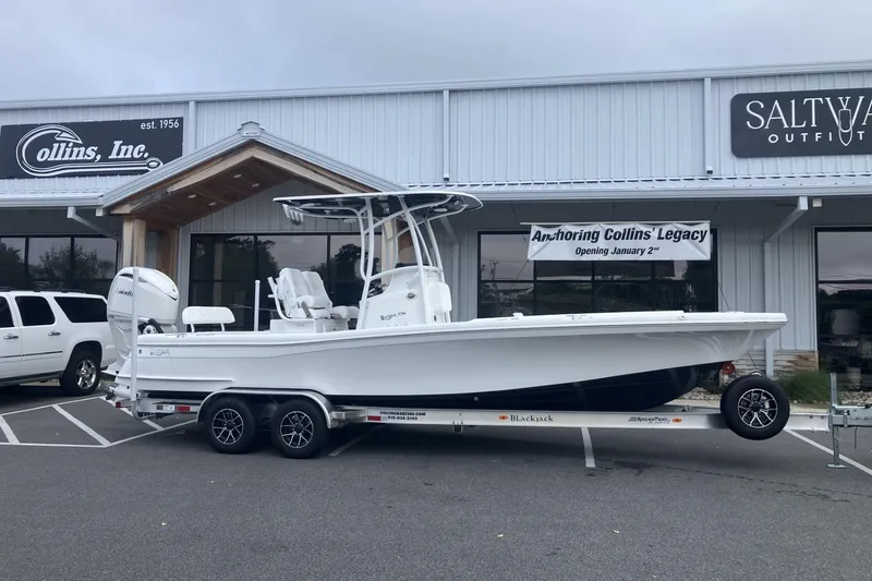 Slide: The Image of 2026 BlackJack 256 Coastal boat on trailer outside Collins Inc. store. - 4