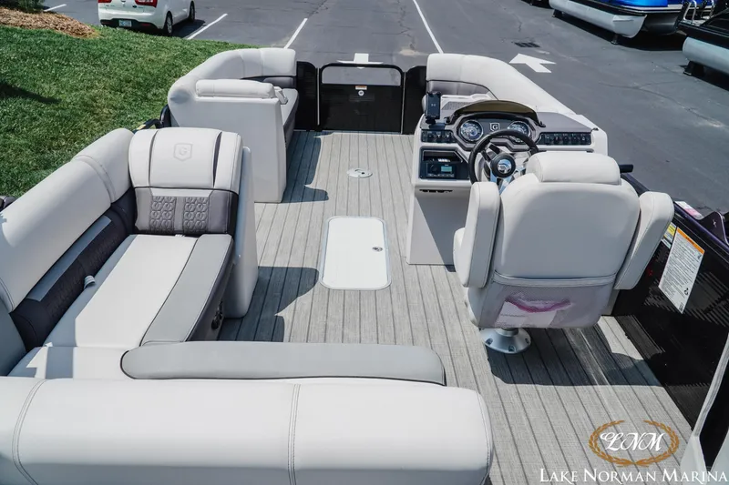Slide: The Image of 2023 Godfrey Sweet Water 2286 SFL pontoon boat interior with plush seating and modern dashboard. - 5