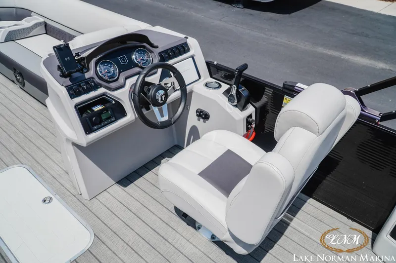 Slide: The Image of 2023 Godfrey Sweet Water 2286 SFL boat interior with modern steering console and seating. - 9