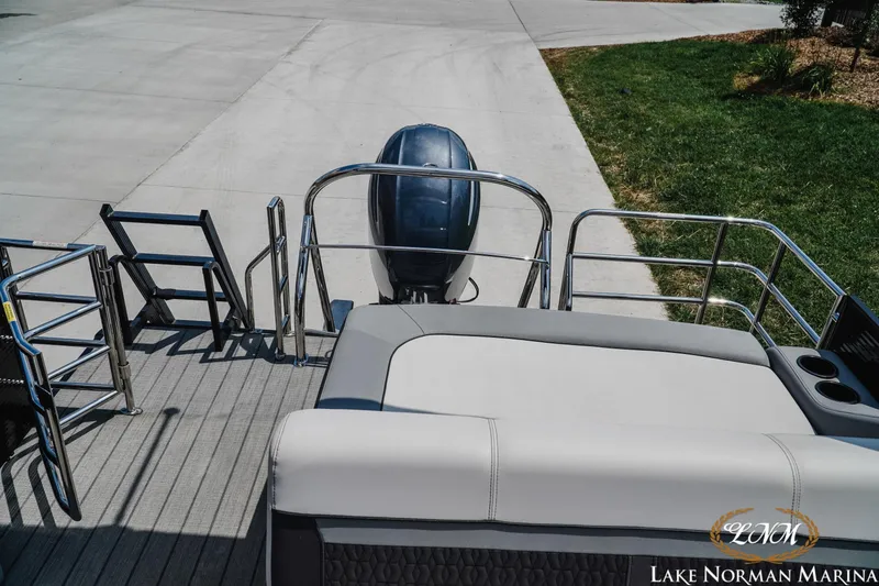 Slide: The Image of 2023 Godfrey Sweet Water 2286 SFL boat at Lake Norman Marina, rear view with motor. - 18