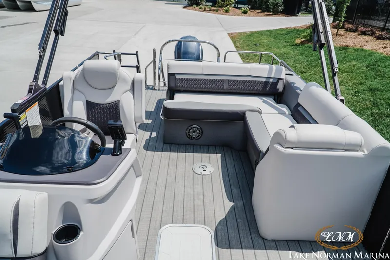 Slide: The Image of 2023 Godfrey Sweet Water 2286 SFL pontoon boat interior with plush seating and steering console. - 16