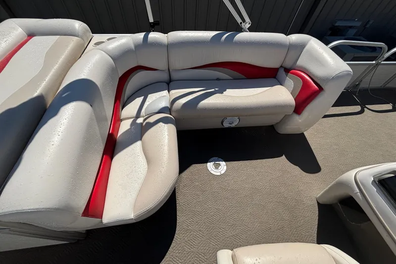 Slide: The Image of 2008 Sun Tracker Fishin' Barge 21 Signature Series with beige and red seating. - 7
