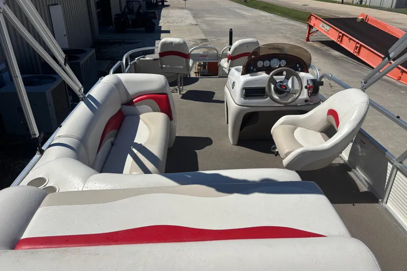 Slide: The Image of 2008 Sun Tracker Fishin' Barge 21 Signature Series interior with seating and steering console. - 5