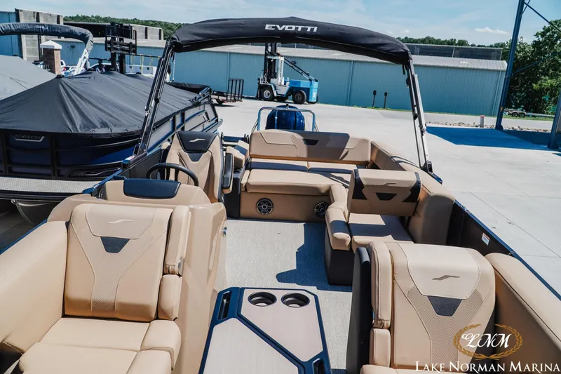 Slide: The Image of 2026 Evotti 523CS pontoon boat with luxurious seating at Lake Norman Marina. - 14