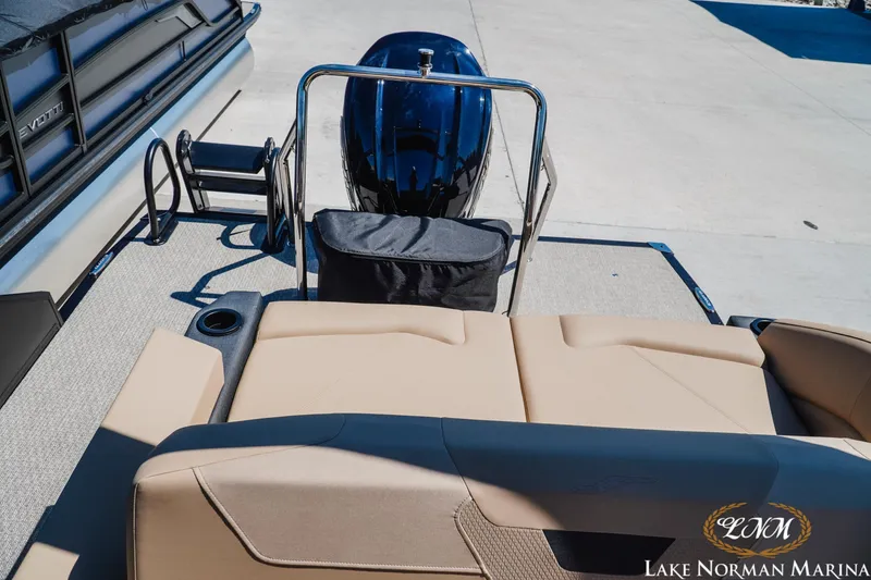 Slide: The Image of Evotti 523CS 2026 boat interior with beige seating at Lake Norman Marina. - 23