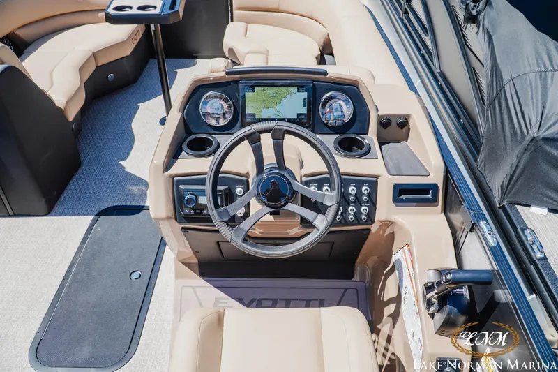 Slide: The Image of 2026 Evotti 523CS boat dashboard with steering wheel and navigation display. - 11