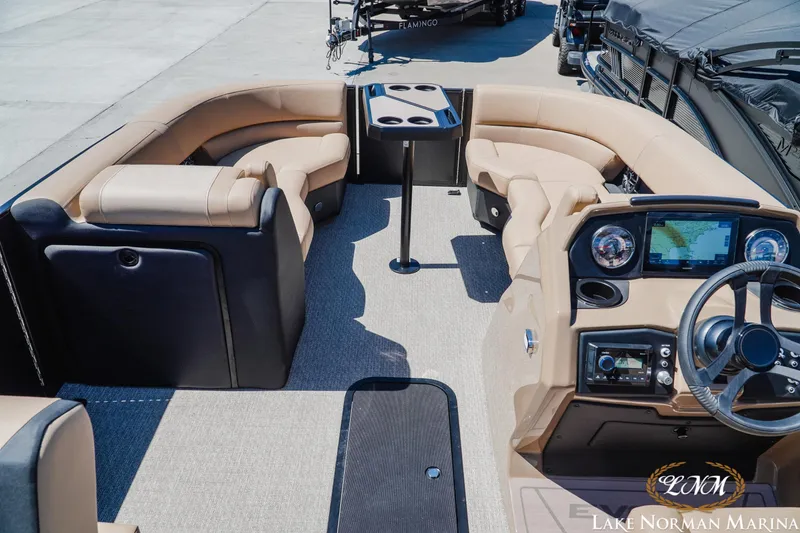 Slide: The Image of Luxurious 2026 Evotti 523CS boat interior with plush seating and modern dashboard at Lake Norman Marina. - 9