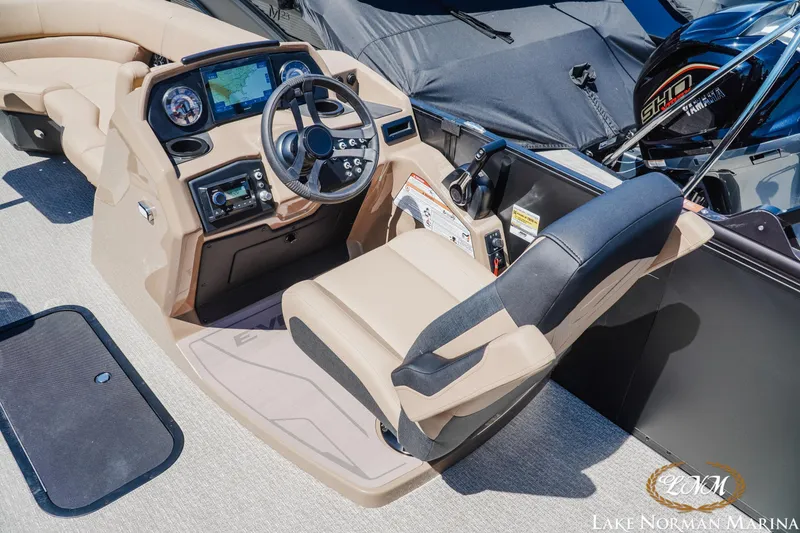 Slide: The Image of Cockpit of 2026 Evotti 523CS boat with steering wheel and navigation display. - 10