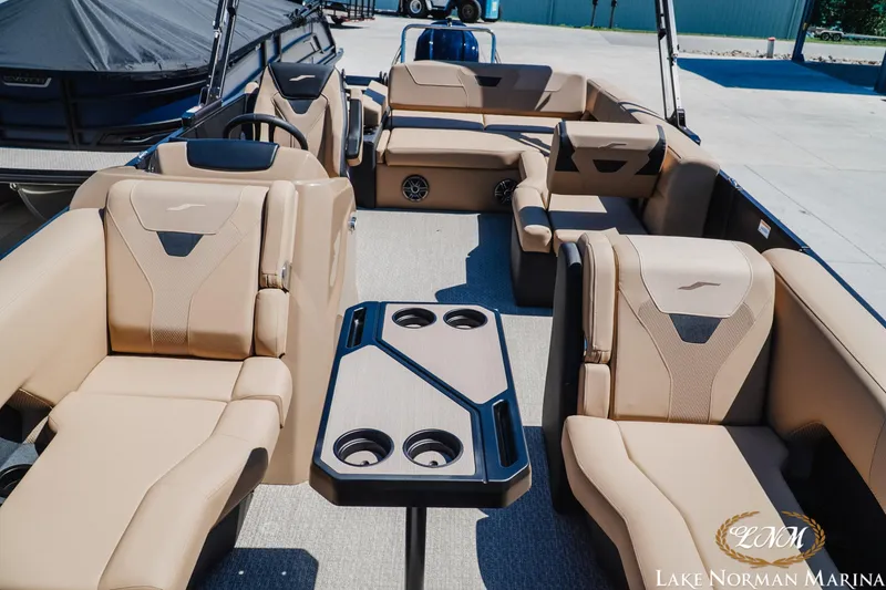 Slide: The Image of Luxurious interior of 2026 Evotti 523CS boat at Lake Norman Marina, featuring plush seating and table. - 15