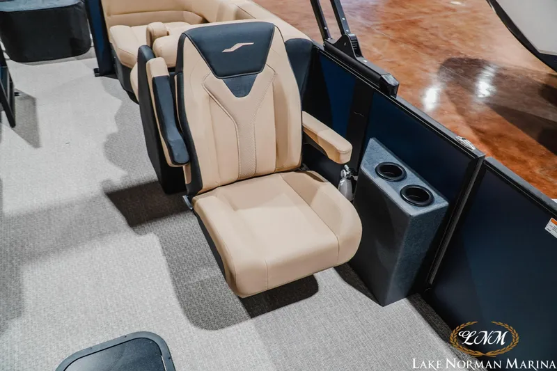 Slide: The Image of Luxurious beige seating on 2027 Evotti 521QL boat, featuring cup holders and armrests. - 21