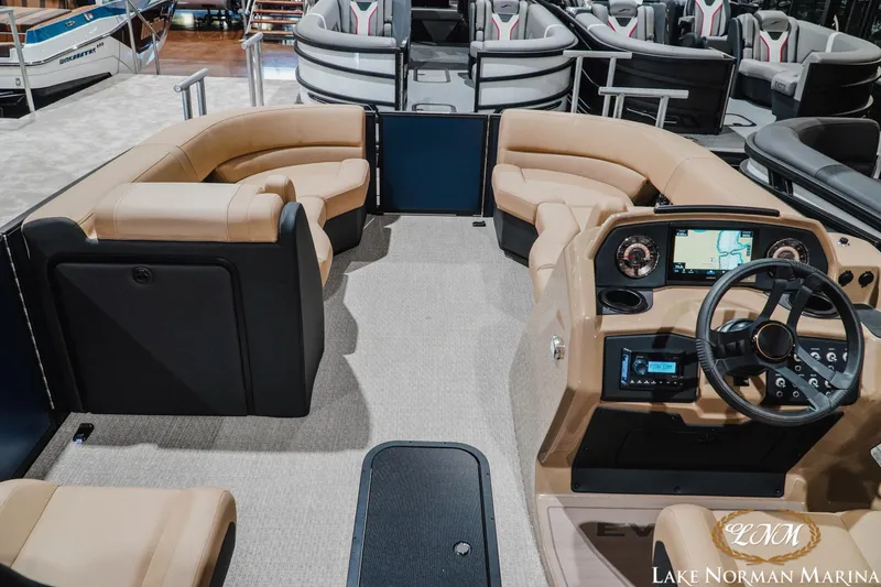 Slide: The Image of Interior of 2027 Evotti 521QL pontoon boat with modern dashboard and seating at Lake Norman Marina. - 11