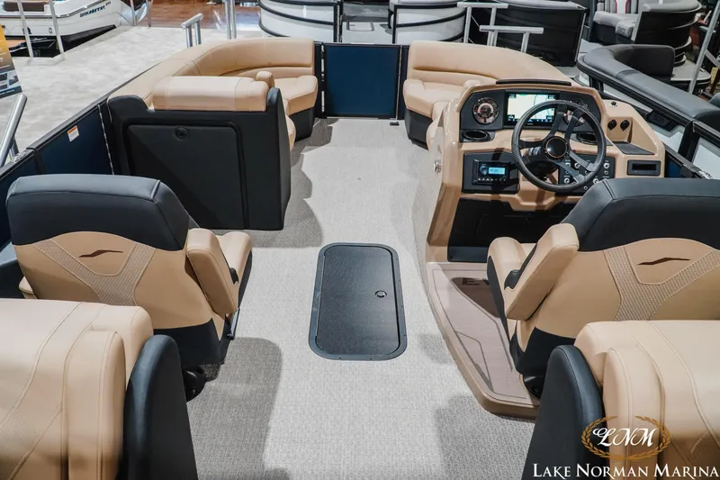 Slide: The Image of Luxurious 2027 Evotti 521QL boat interior with plush seating and modern dashboard at Lake Norman Marina. - 9