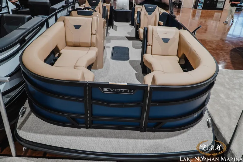 Slide: The Image of 2027 Evotti 521QL pontoon boat with beige seating, showcased at Lake Norman Marina. - 17