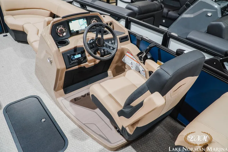 Slide: The Image of 2027 Evotti 521QL boat interior with modern dashboard and comfortable seating at Lake Norman Marina. - 10