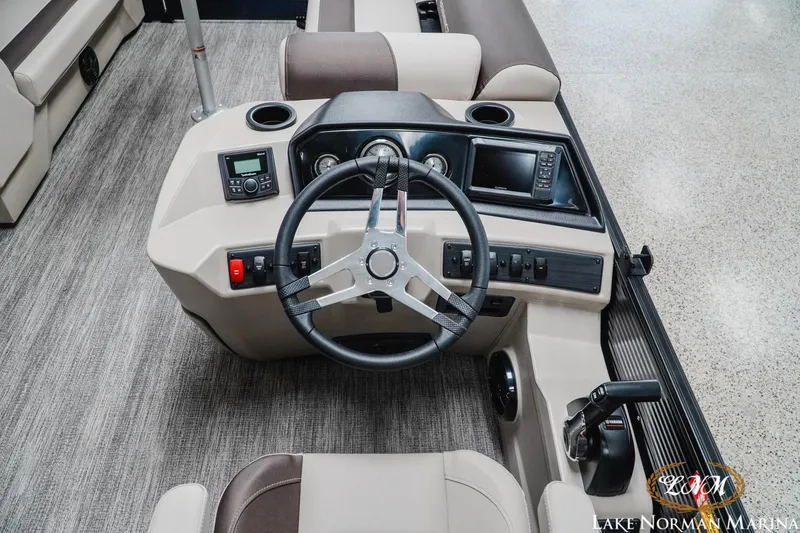 Slide: The Image of 2026 Bennington 22SSB boat dashboard with steering wheel and control panel. - 16