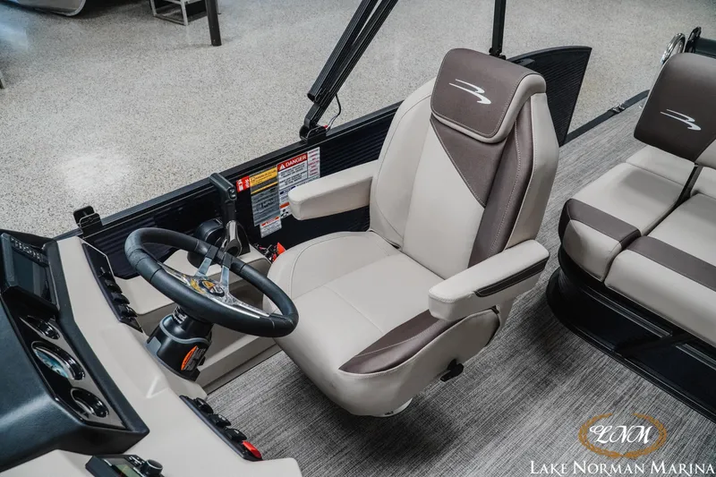 Slide: The Image of Captain's chair and helm of 2026 Bennington 22SSB pontoon boat at Lake Norman Marina. - 14