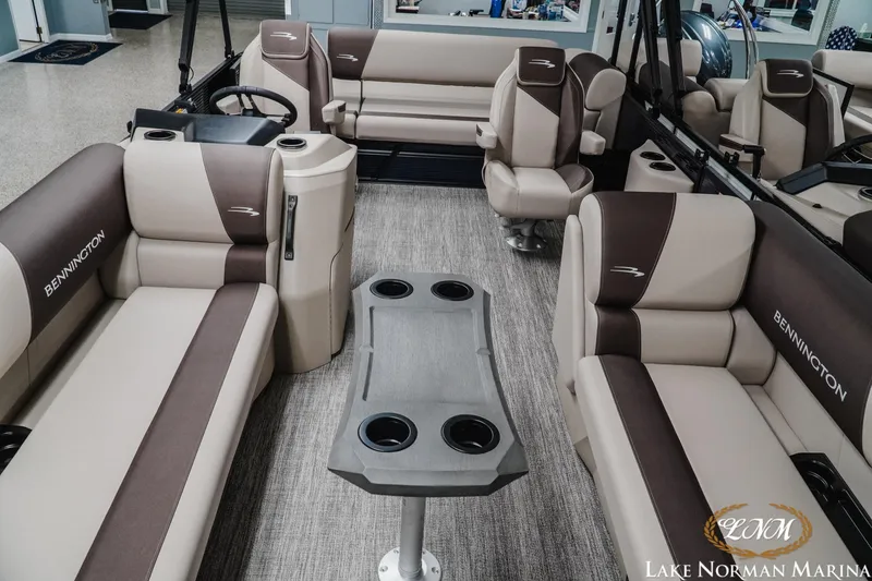 Slide: The Image of Interior of 2026 Bennington 22SSB pontoon boat with luxurious seating and cup holders. - 9