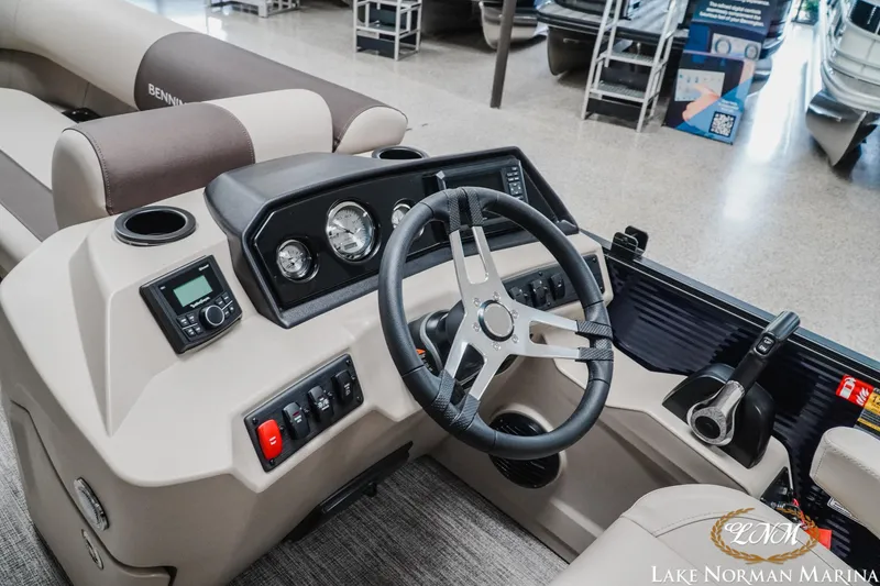Slide: The Image of Interior view of 2026 Bennington 22SSB boat dashboard with steering wheel and controls. - 17