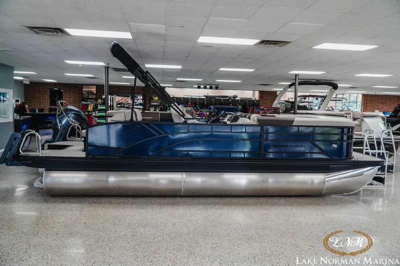 The Image of 2026 Bennington 22SSB pontoon boat displayed indoors at Lake Norman Marina. - 1