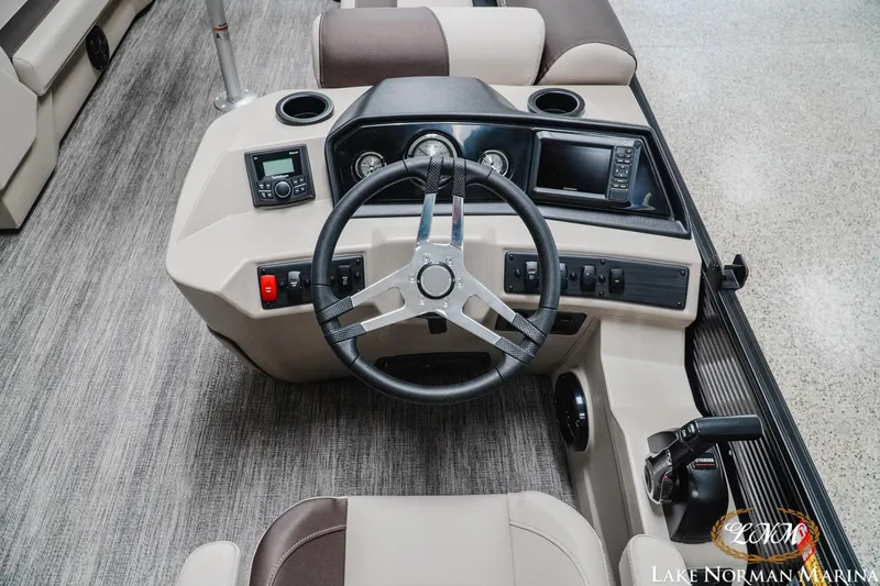 Slide: The Image of 2026 Bennington 22SSB boat dashboard with steering wheel and control panel. - 6