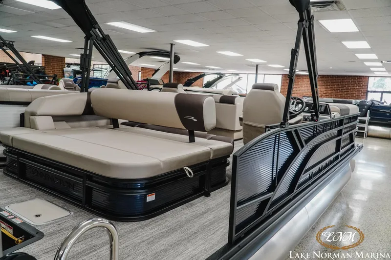 Slide: The Image of 2026 Bennington 22SSB pontoon boat interior at Lake Norman Marina showroom. - 3
