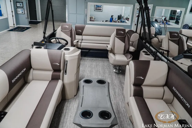 Slide: The Image of 2026 Bennington 22SSB pontoon boat interior with plush seating and modern design at Lake Norman Marina. - 8