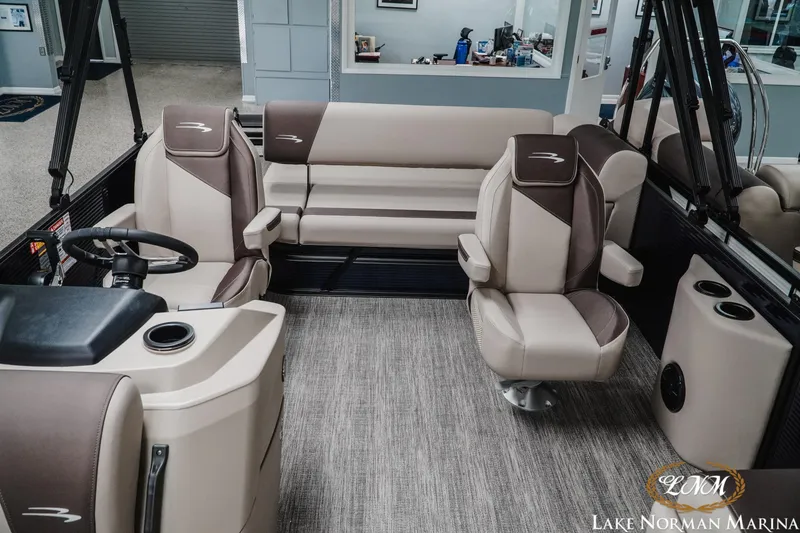 Slide: The Image of 2026 Bennington 22SSB pontoon boat interior with plush seating and modern helm. - 12