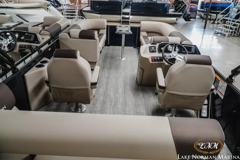 Slide: The Image of Interior of 2026 Bennington 22SSB pontoon boat with luxurious seating and modern dashboard. - 4