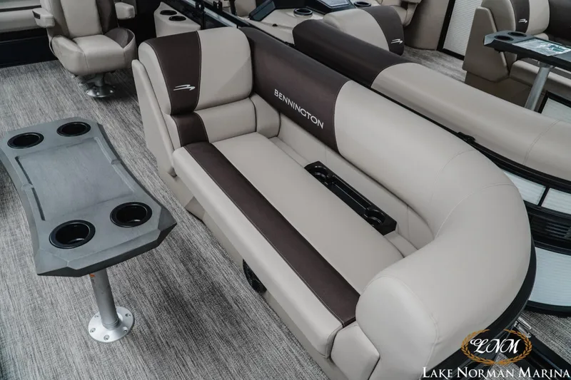 Slide: The Image of 2026 Bennington 22SSB pontoon boat interior with plush seating and cup holders. - 11