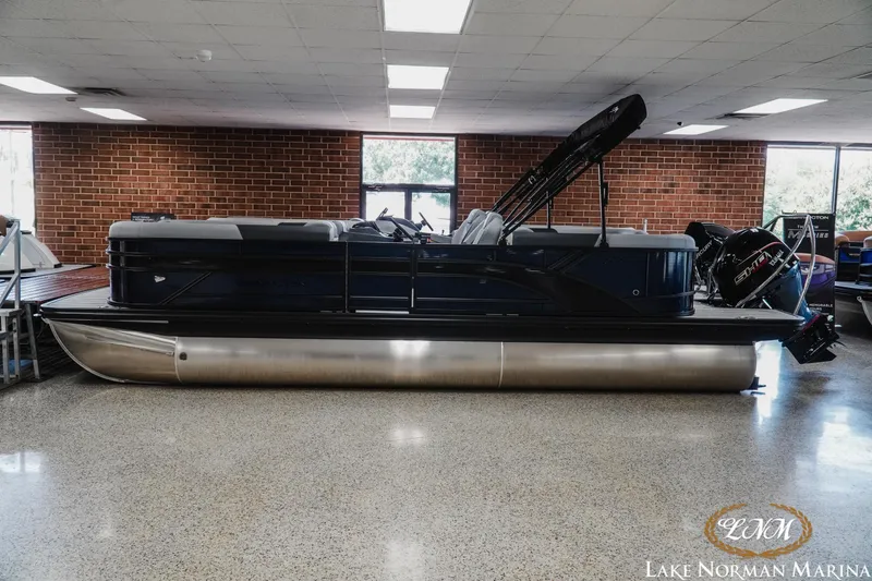 The Image of 2027 Bennington 23SSR pontoon boat displayed indoors at Lake Norman Marina. - 1