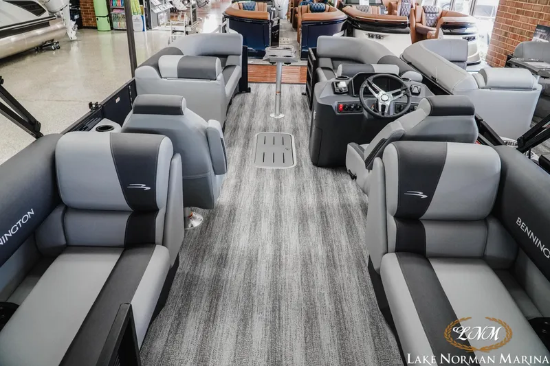 Slide: The Image of 2027 Bennington 23SSR pontoon boat interior with plush seating at Lake Norman Marina. - 5