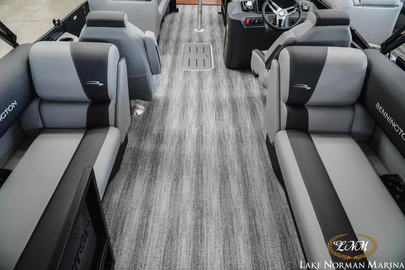 Slide: The Image of 2027 Bennington 23SSR pontoon boat interior with plush seating and modern helm at Lake Norman Marina. - 6