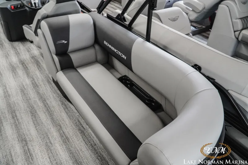 Slide: The Image of 2027 Bennington 23SSR boat interior with luxurious gray seating at Lake Norman Marina. - 8