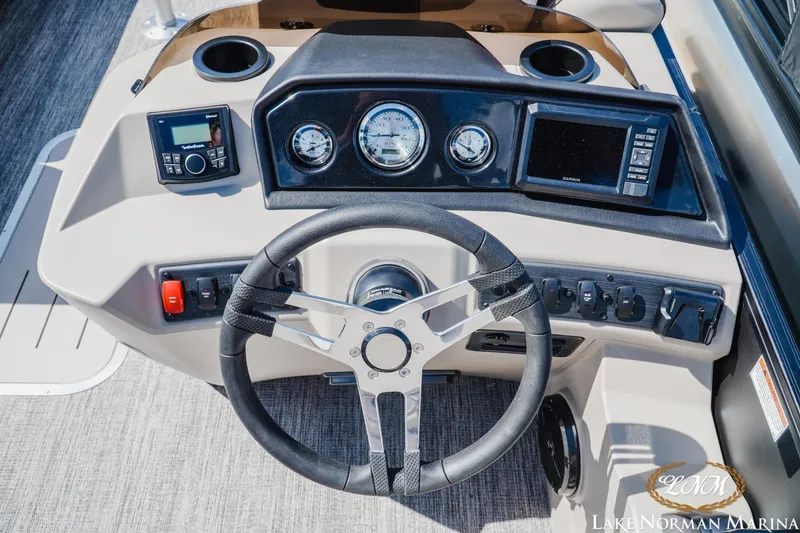 Slide: The Image of Steering console of a 2027 Bennington 23ssb boat with modern controls and gauges. - 12