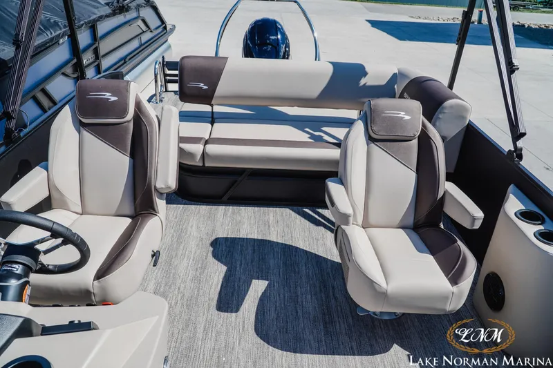 Slide: The Image of 2027 Bennington 23ssb boat interior with plush seating and modern design at Lake Norman Marina. - 18