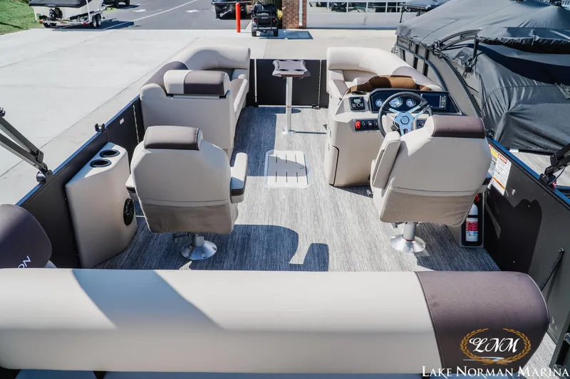 Slide: The Image of Interior of a 2027 Bennington 23ssb pontoon boat with plush seating and modern dashboard. - 8