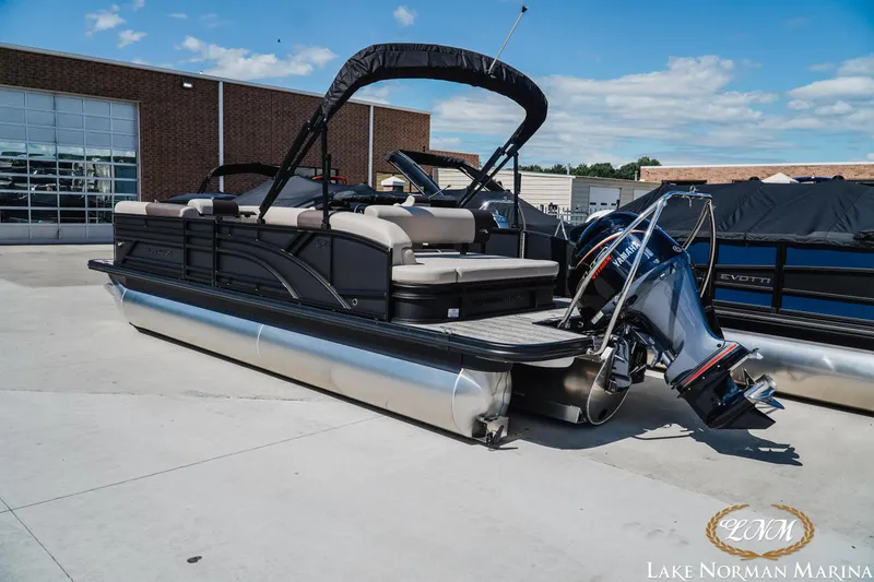 Slide: The Image of 2027 Bennington 23ssb pontoon boat at Lake Norman Marina, featuring Yamaha outboard motor. - 4