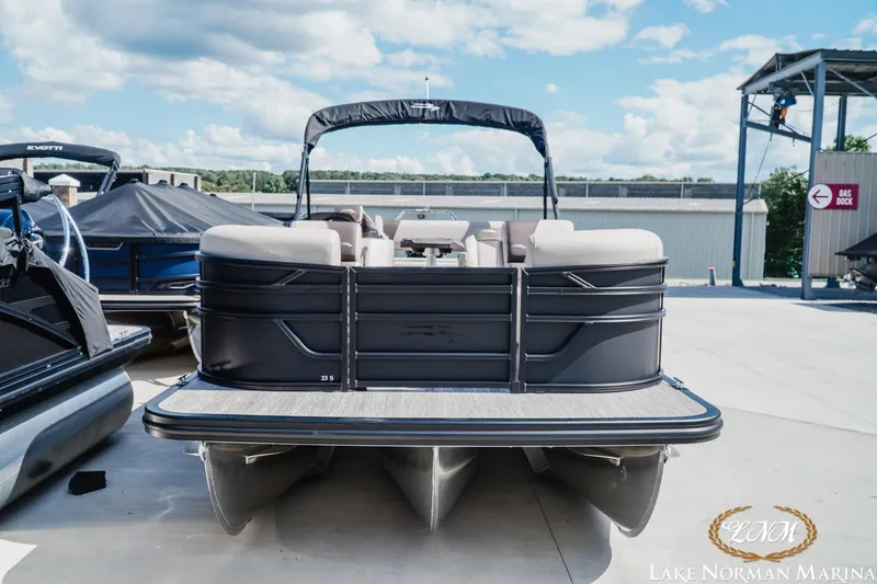 Slide: The Image of 2027 Bennington 23ssb pontoon boat at Lake Norman Marina, featuring sleek design and spacious seating. - 3