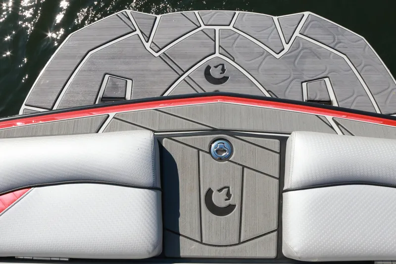 Slide: The Image of 2024 Centurion Fi23 boat deck with stylish gray and red design, featuring cushioned seating. - 8