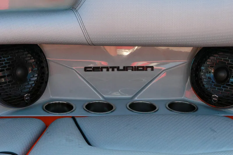 Slide: The Image of 2024 Centurion Fi23 boat interior with speakers and cup holders. - 16