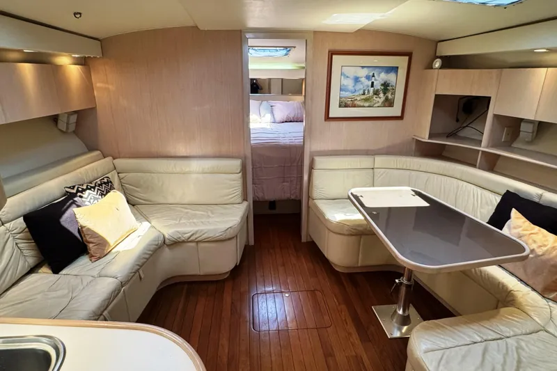 Slide: The Image of Luxurious 1995 Tiara Yachts 4300 Open interior with elegant seating and dining area. - 15