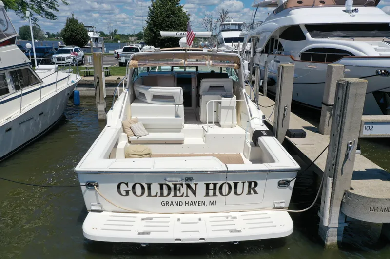 Slide: The Image of 1995 Tiara Yachts 4300 Open docked, named "Golden Hour," in Grand Haven, MI. - 3